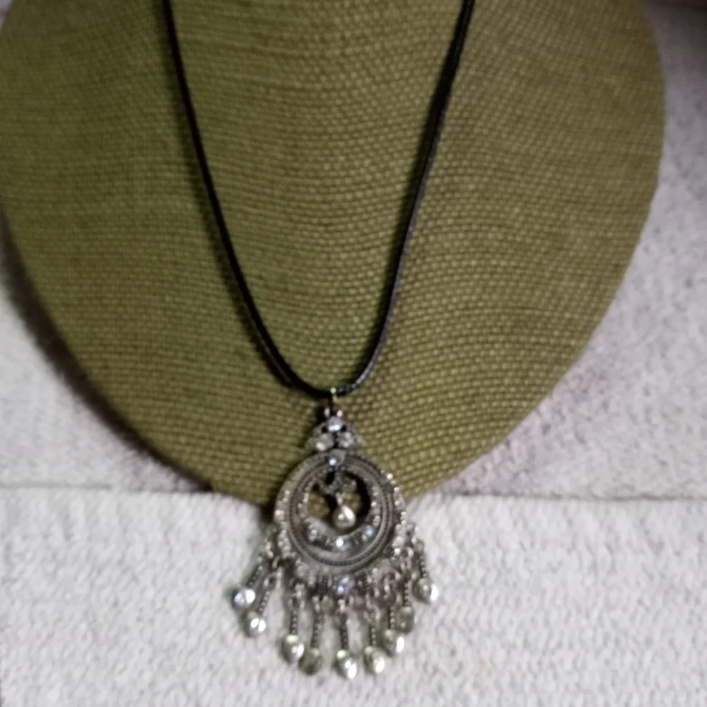 Silvertone crystal Premier designs pendant on black cord